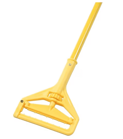 A yellow mop handle is leaning against the side of a floor.