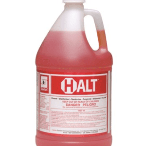 A gallon of red liquid is sitting on the floor.