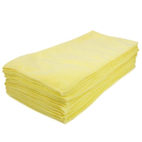 A stack of yellow towels on top of each other.