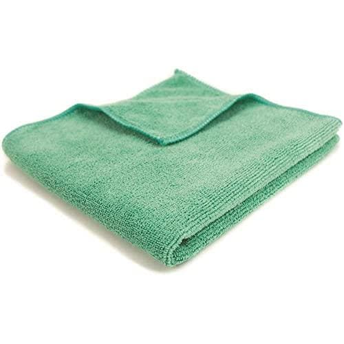 A green towel is folded up to show the corner.