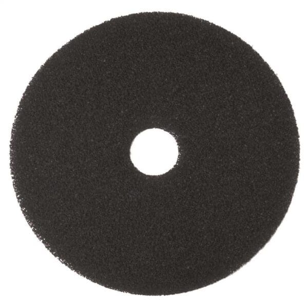 A black circular pad is shown on top of a white background.