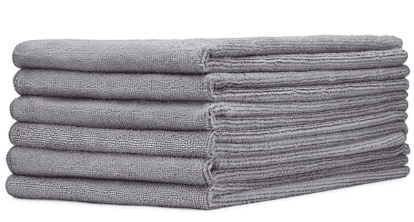 A stack of grey towels folded in half.