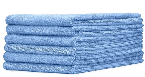 A stack of blue towels on top of each other.